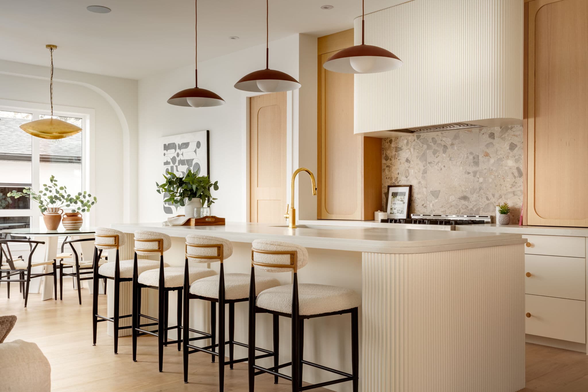 Kitchen island, pendant lighting, and custom cabinetry from a completed Platinum Build Homes project in Calgary.
