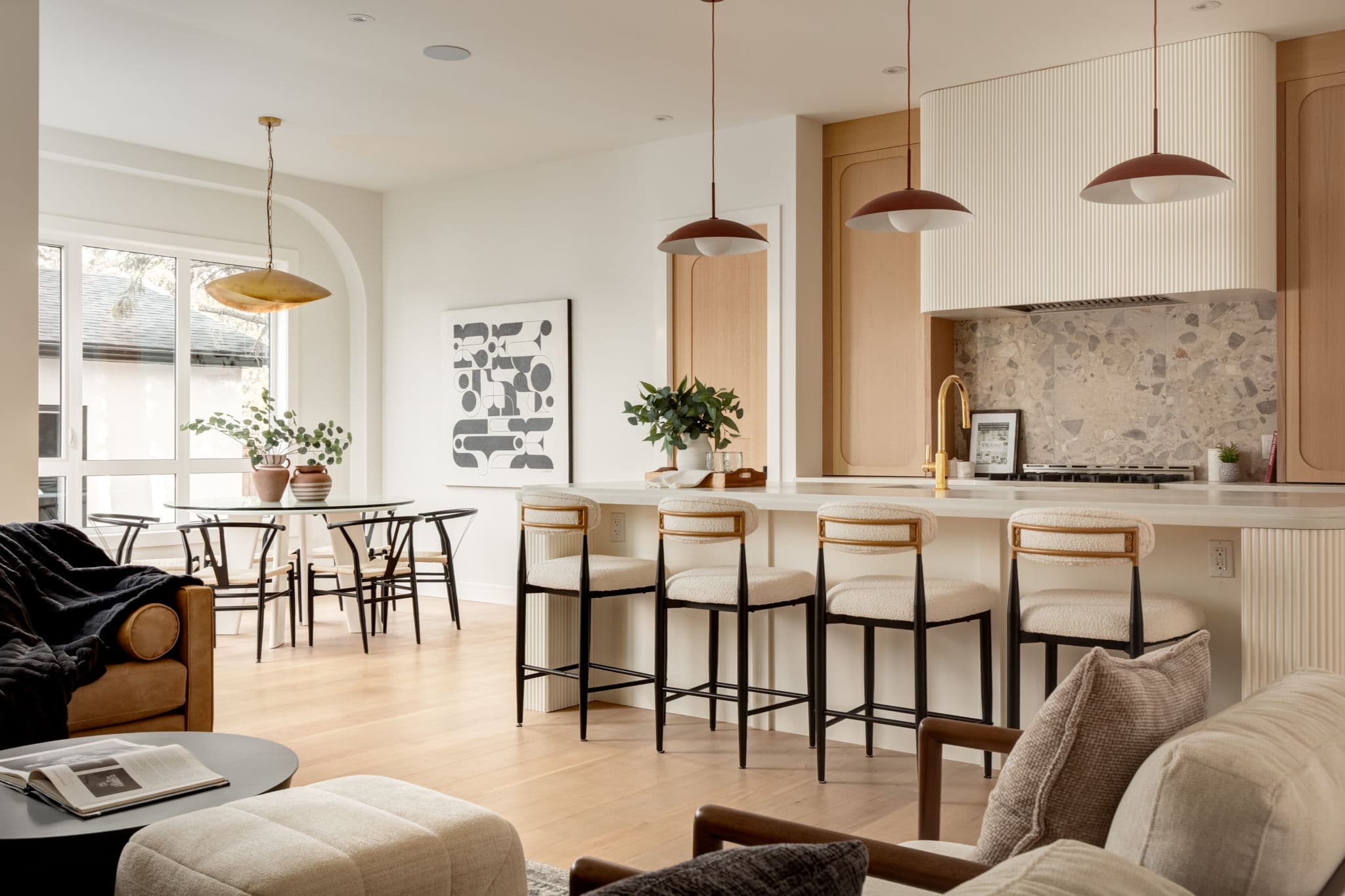 Kitchen, dining, and living area in the Bowness project by Platinum Build Homes in Bowness, Calgary.