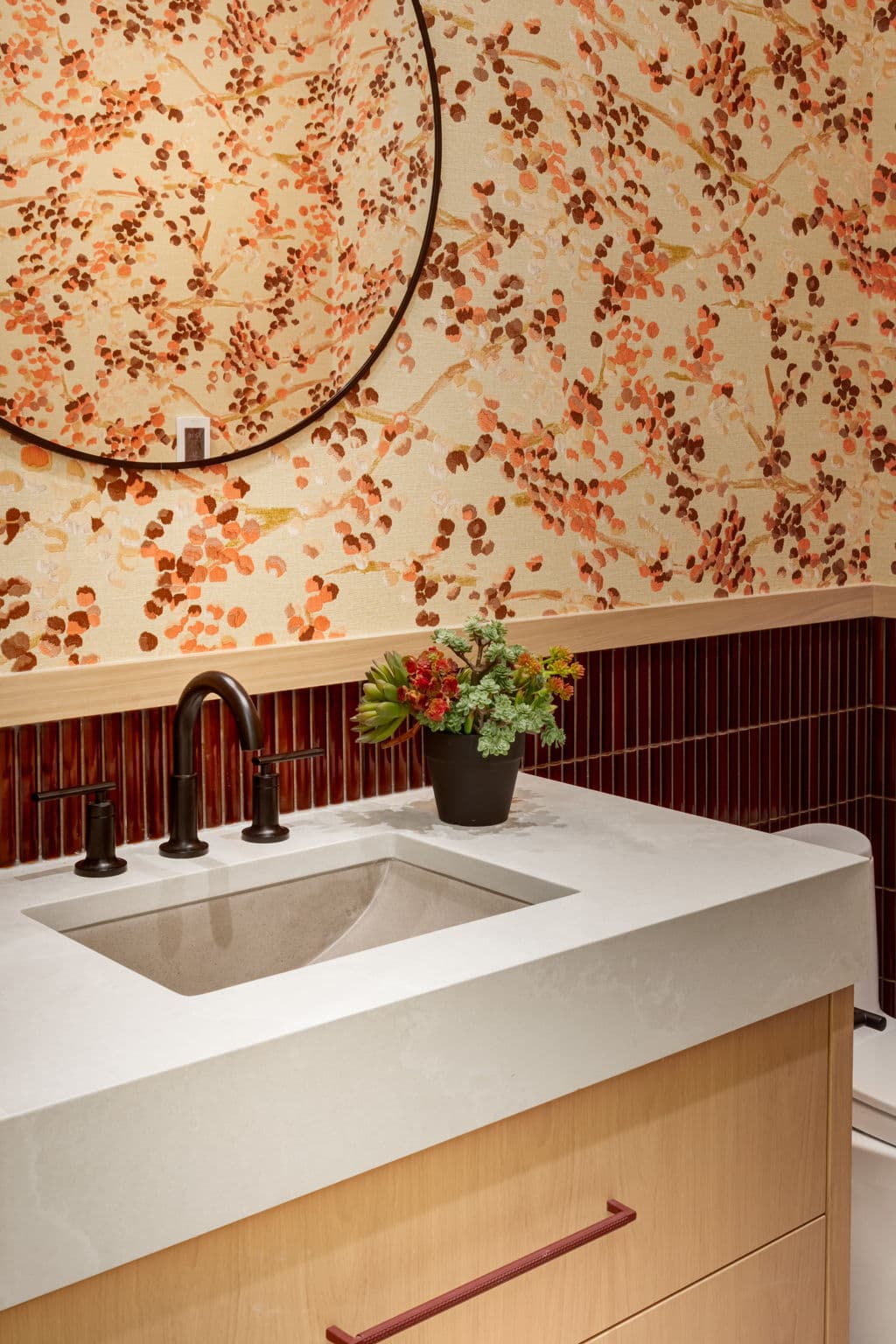 Powder room vanity and wallpaper detail in the Lakeview 1 project by Platinum Build Homes in Lakeview, Calgary.