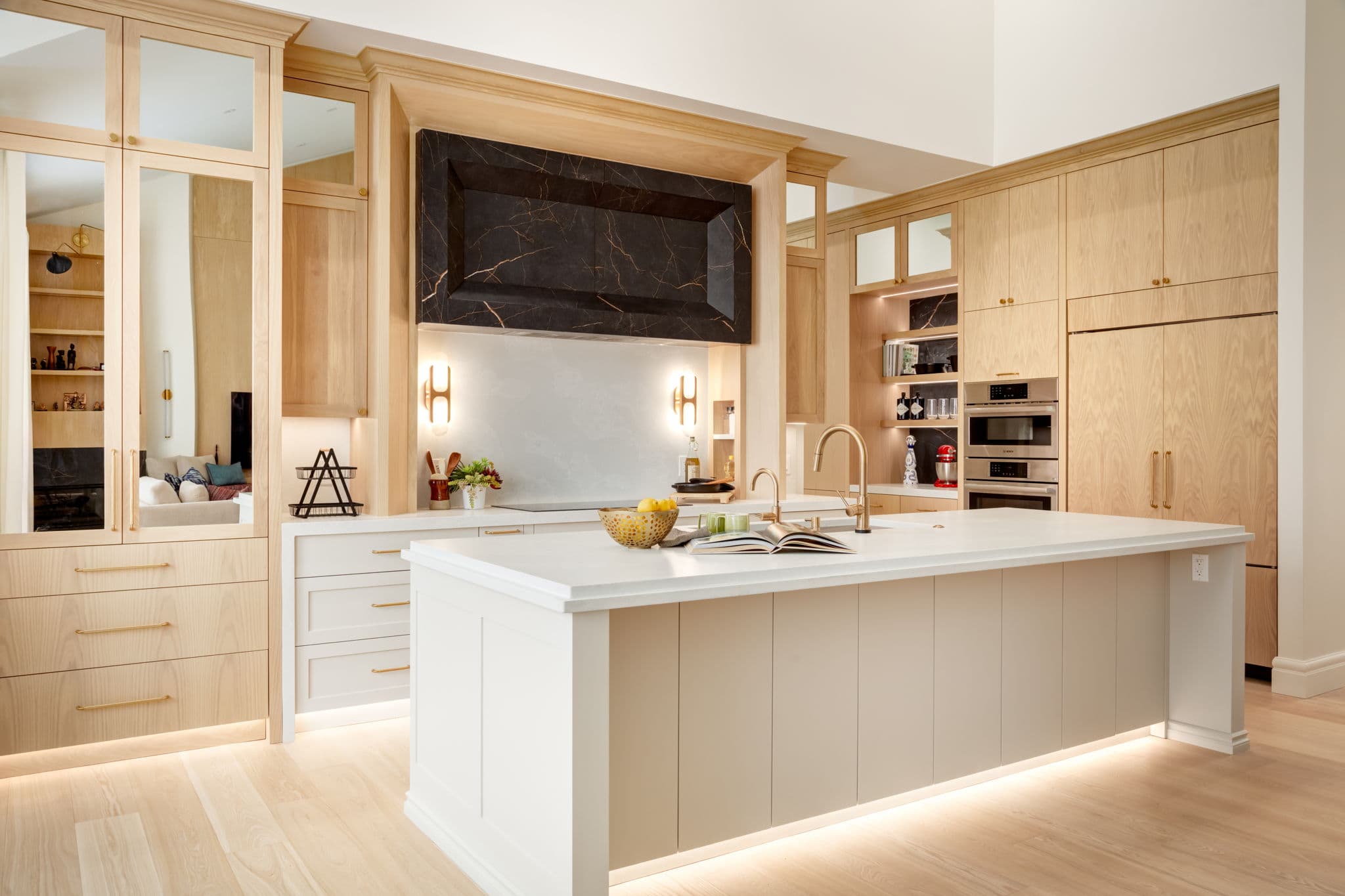 Kitchen with large island and custom millwork in the Lakeview 1 project by Platinum Build Homes in Lakeview, Calgary.