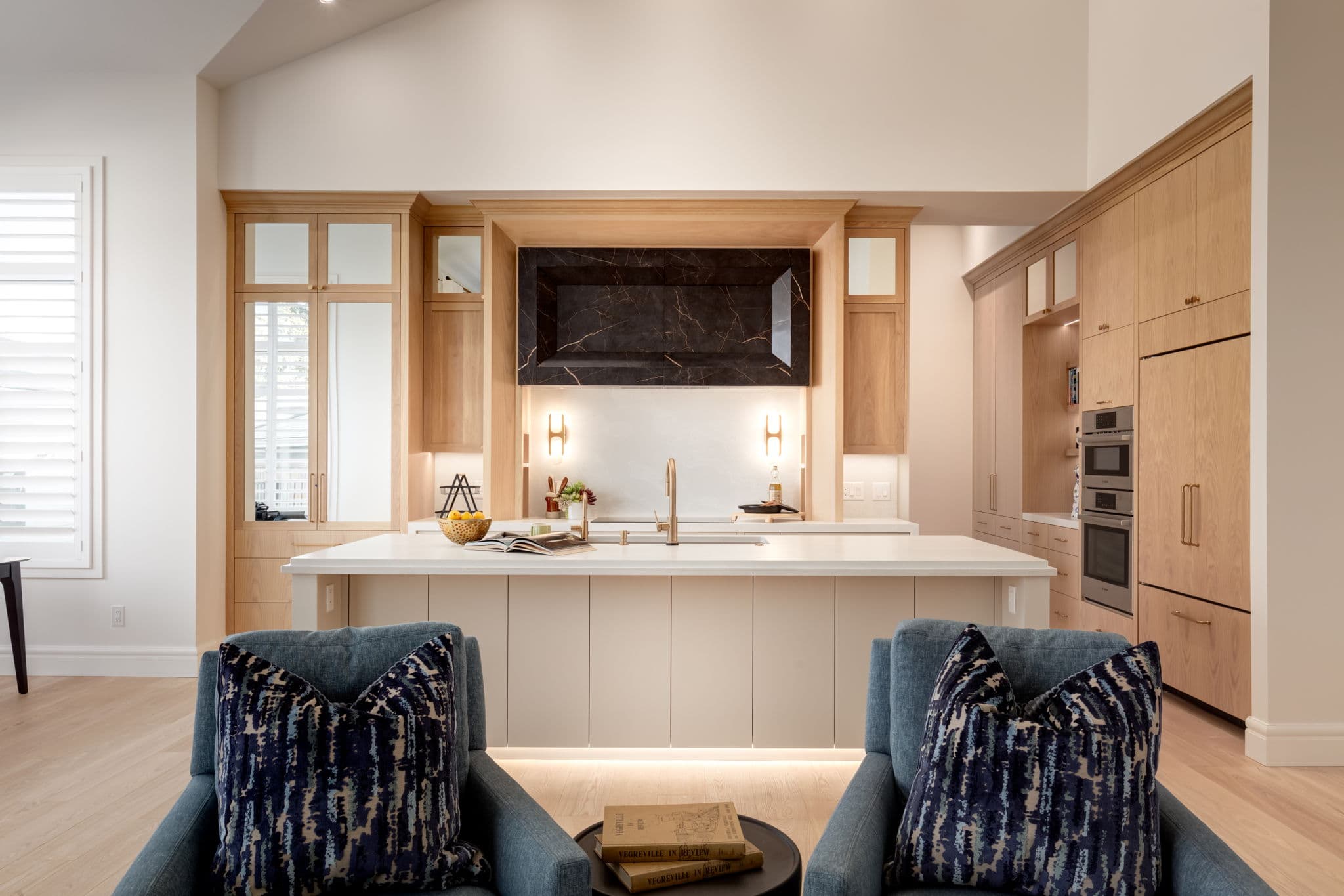 Kitchen and great room overview in the Lakeview 1 project by Platinum Build Homes in Lakeview, Calgary.