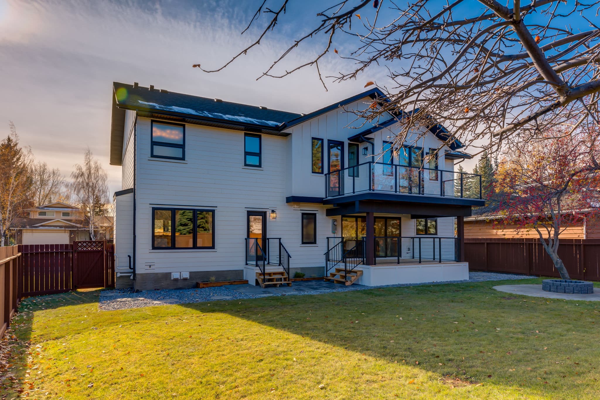 Rear exterior and backyard view in the Varsity 1 project by Platinum Build Homes in Varsity, Calgary.
