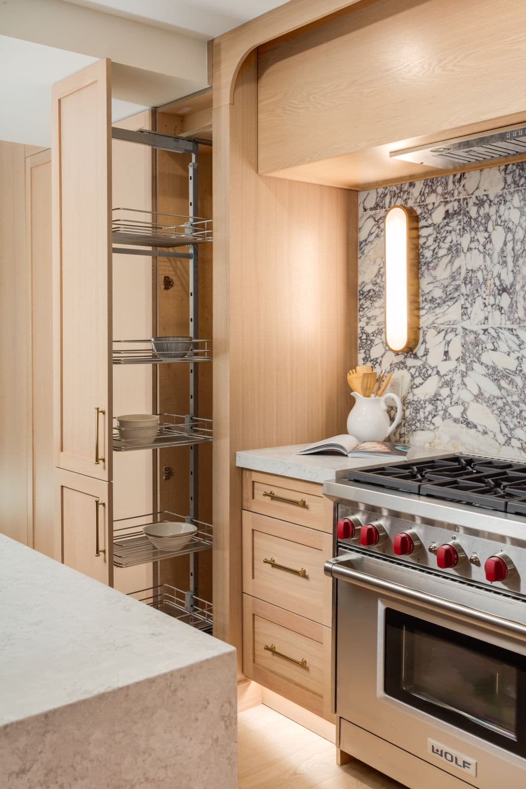 Kitchen range wall and millwork in the Varsity 1 project by Platinum Build Homes in Varsity, Calgary.