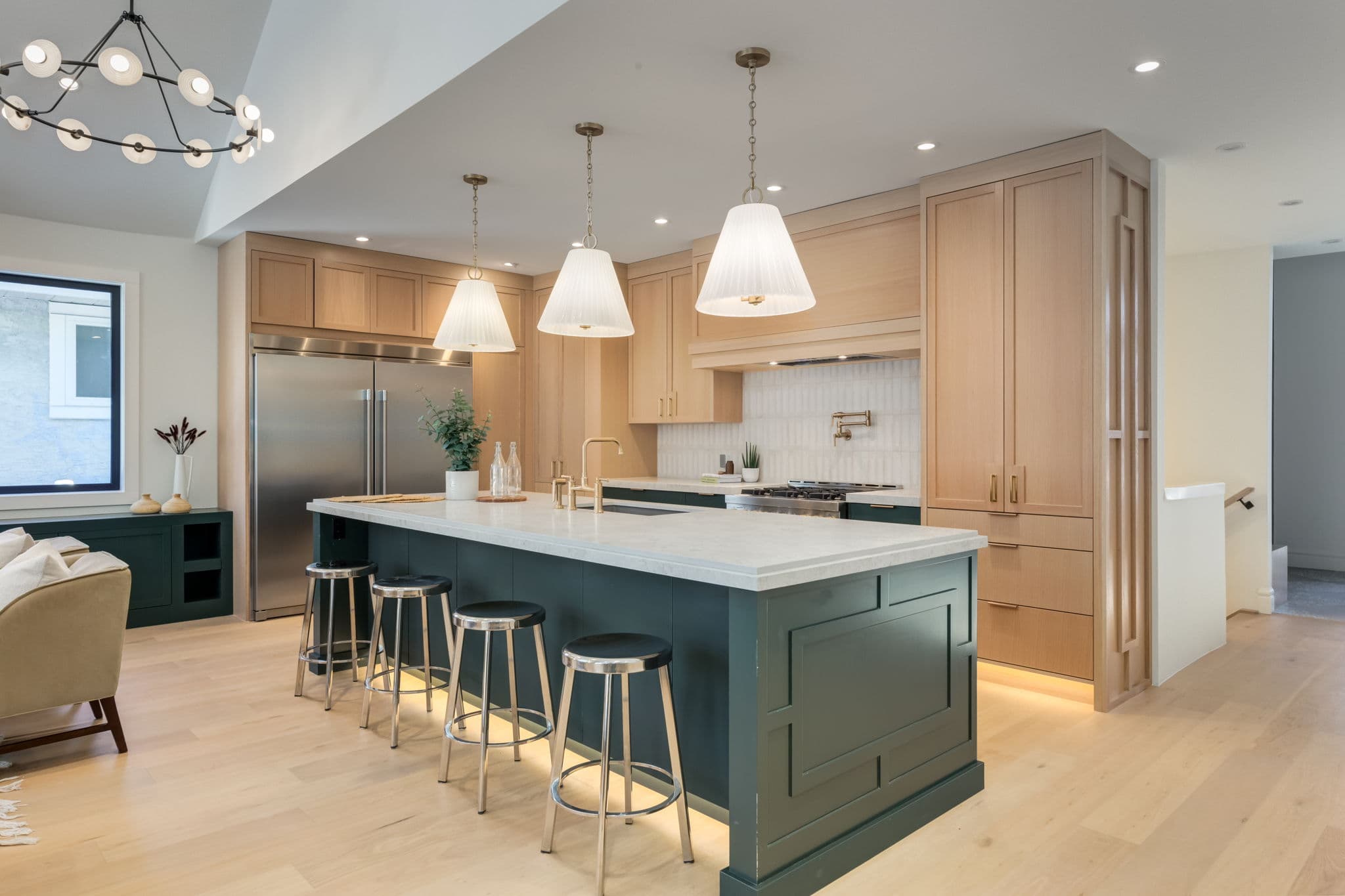 Kitchen island and custom cabinetry in the Varsity 2 project by Platinum Build Homes in Varsity, Calgary.