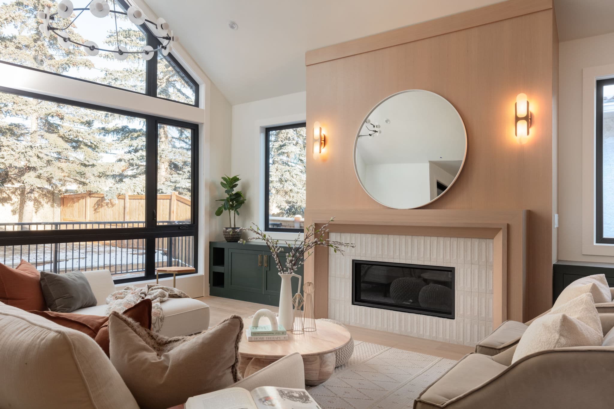 Living room fireplace and seating in the Varsity 2 project by Platinum Build Homes in Varsity, Calgary.