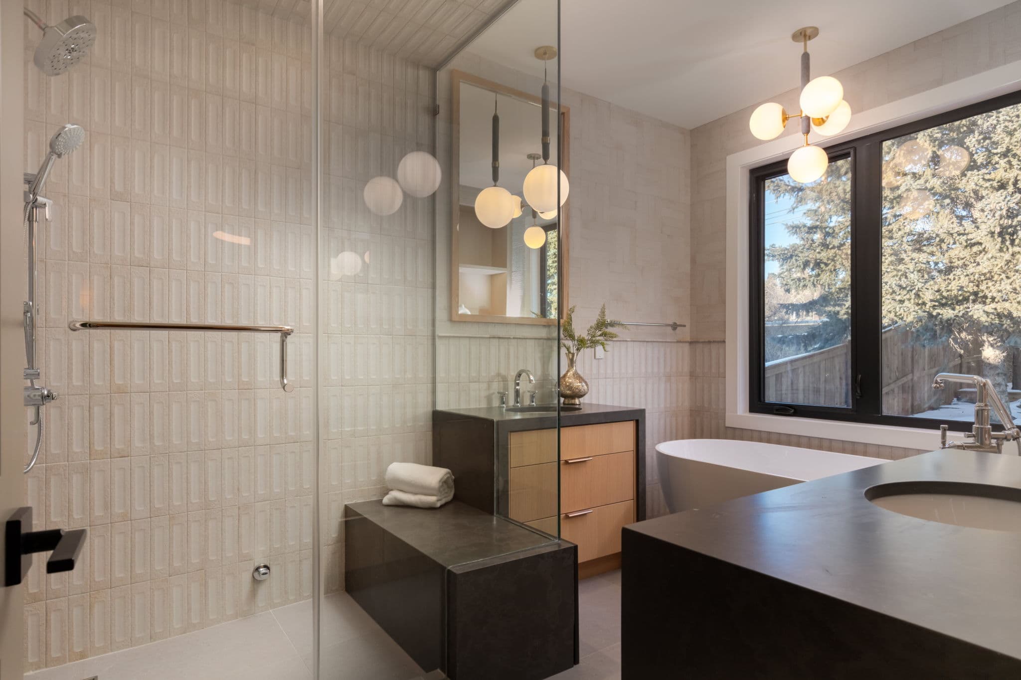 Primary ensuite with tub and shower in the Varsity 2 project by Platinum Build Homes in Varsity, Calgary.