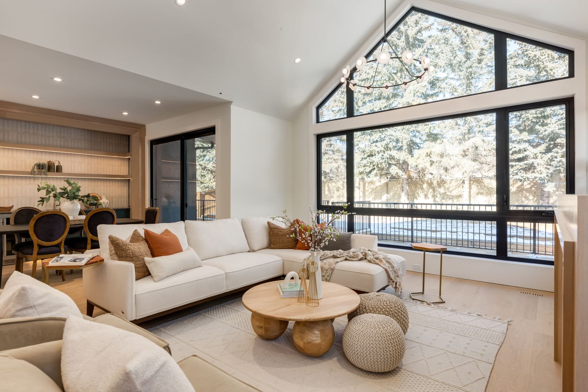 Vaulted living room and kitchen overview in the Varsity 2 project by Platinum Build Homes in Varsity, Calgary.