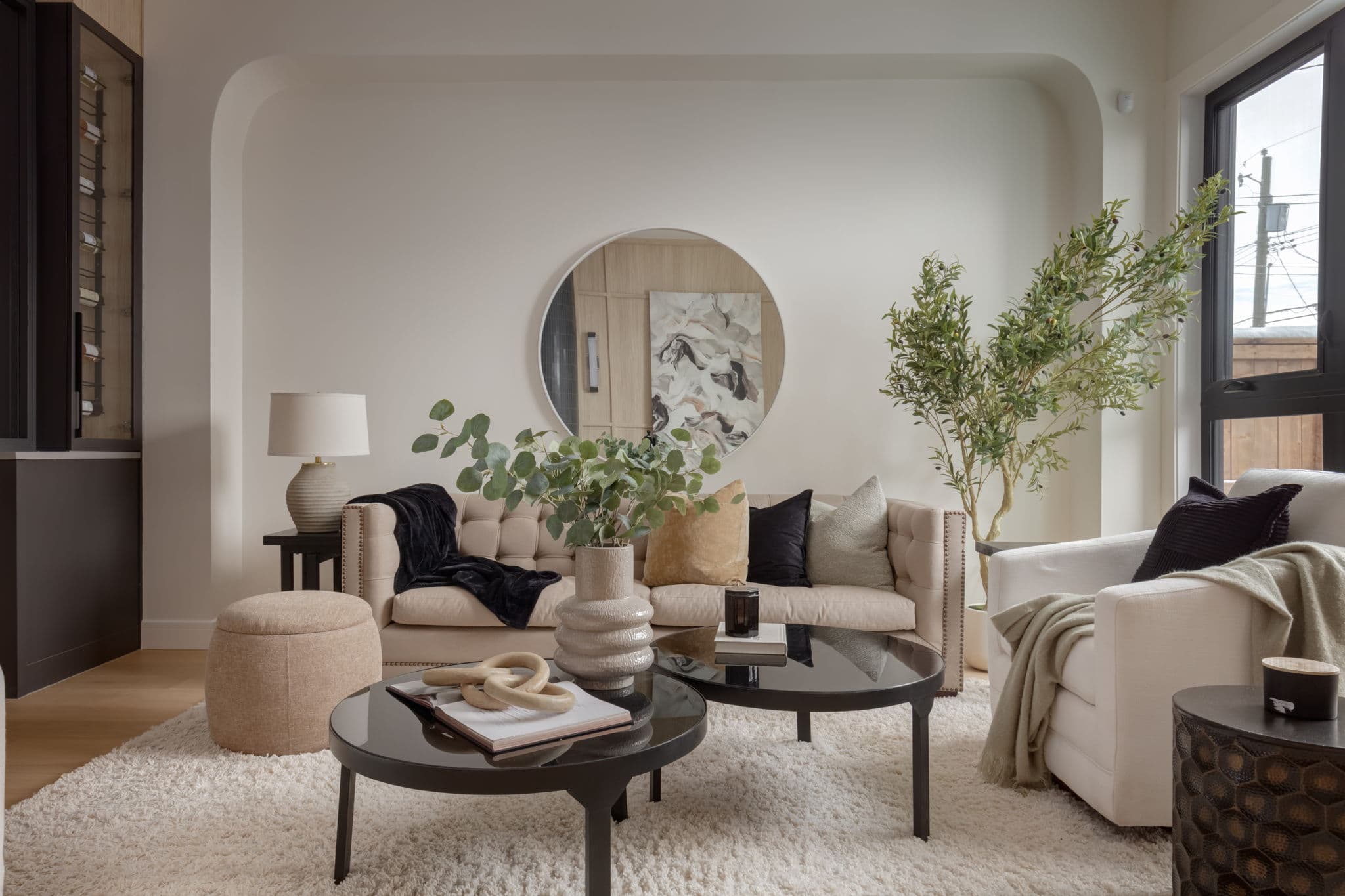 Sitting area with arched opening in the Windsor Park project by Platinum Build Homes in Windsor Park, Calgary.
