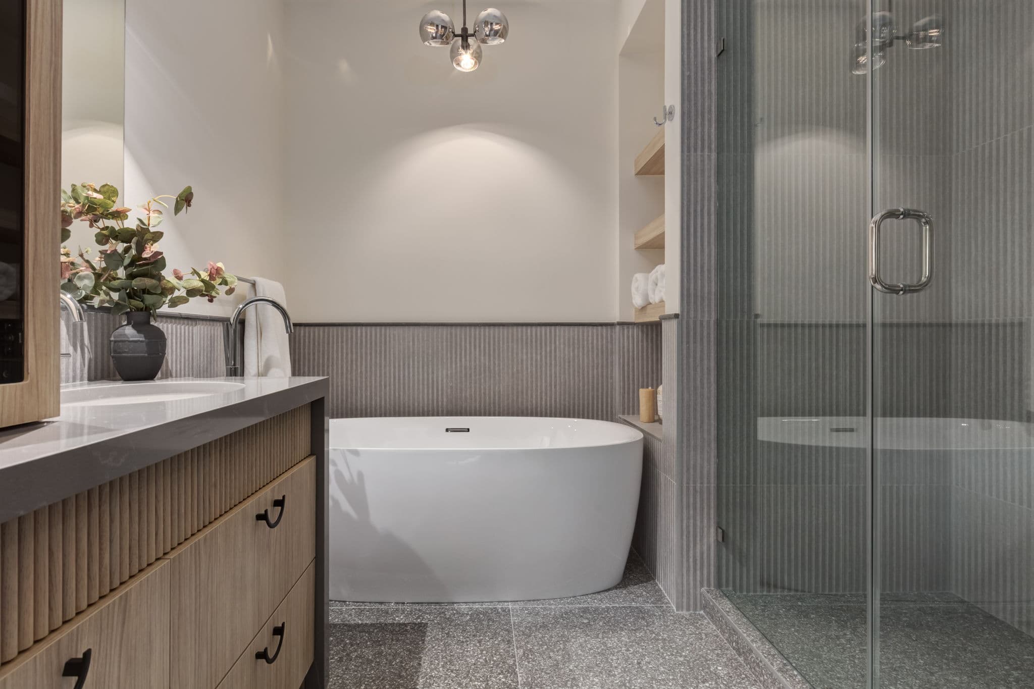 Bathroom with tub and shower in the Windsor Park project by Platinum Build Homes in Windsor Park, Calgary.