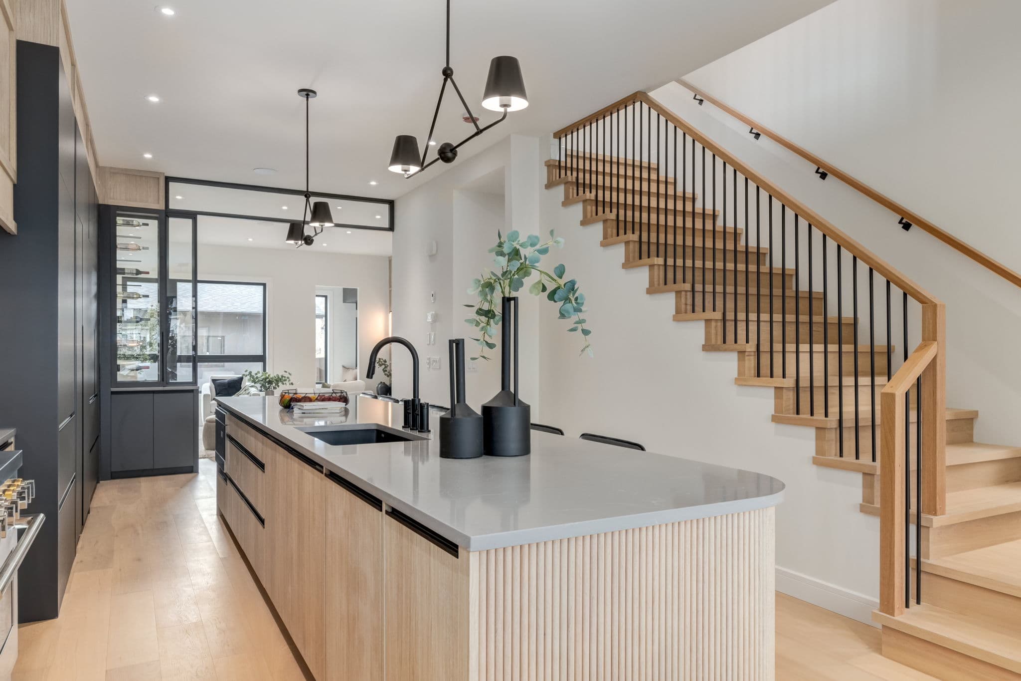 Kitchen and stair overview in the Windsor Park project by Platinum Build Homes in Windsor Park, Calgary.