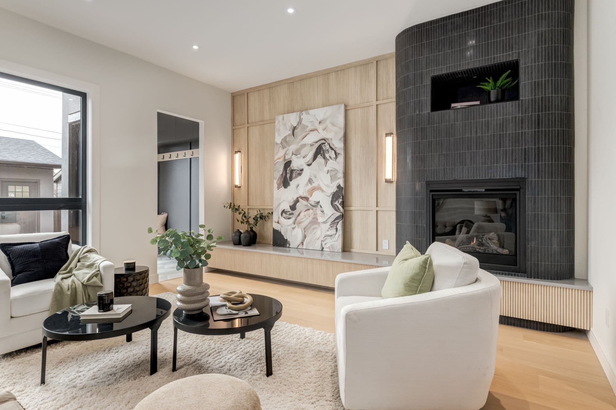 Living room fireplace and seating area in the Windsor Park project by Platinum Build Homes in Windsor Park, Calgary.